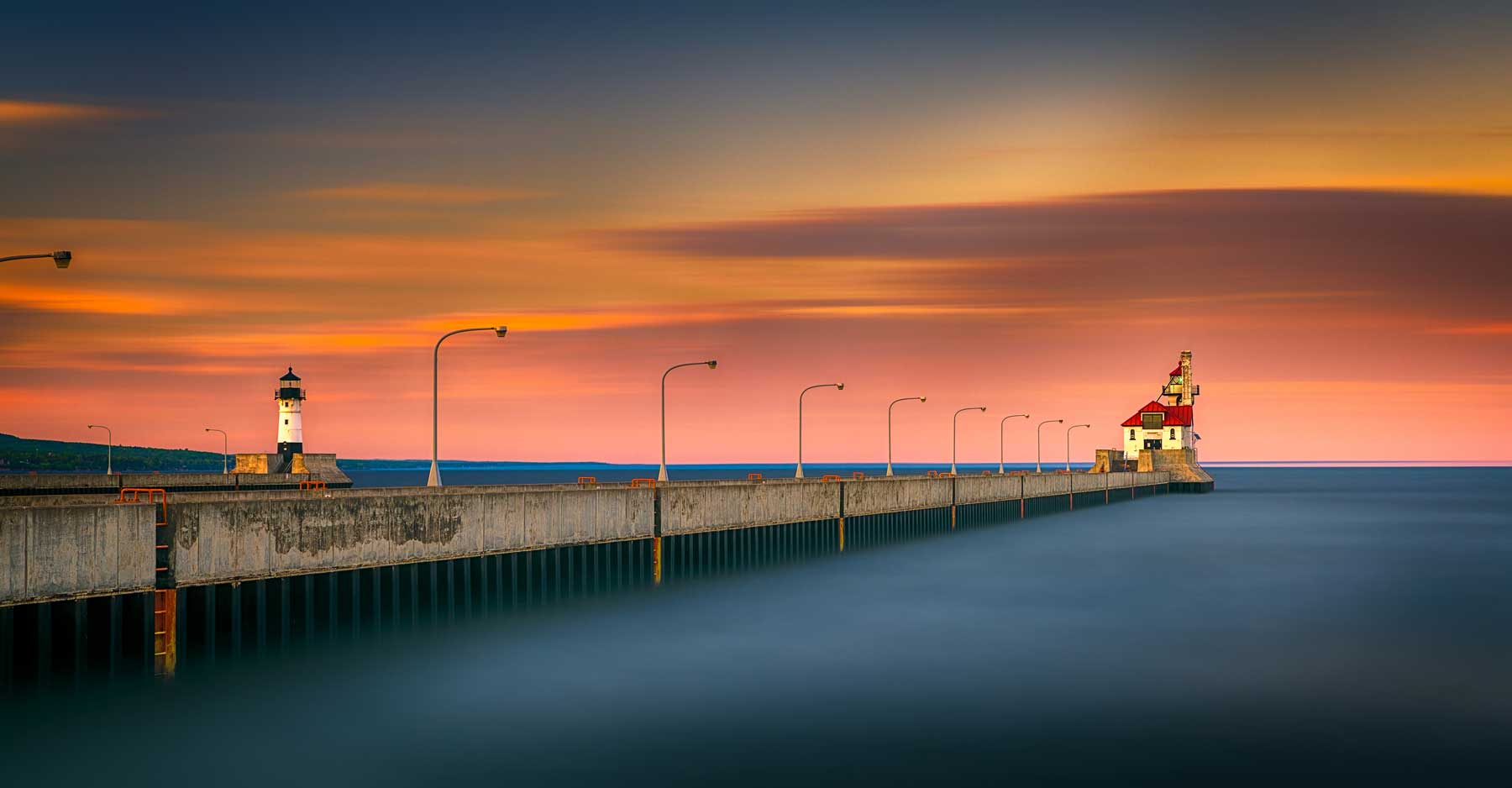 Pink peaceful sunset over the horizon of Lake Superior at Canal